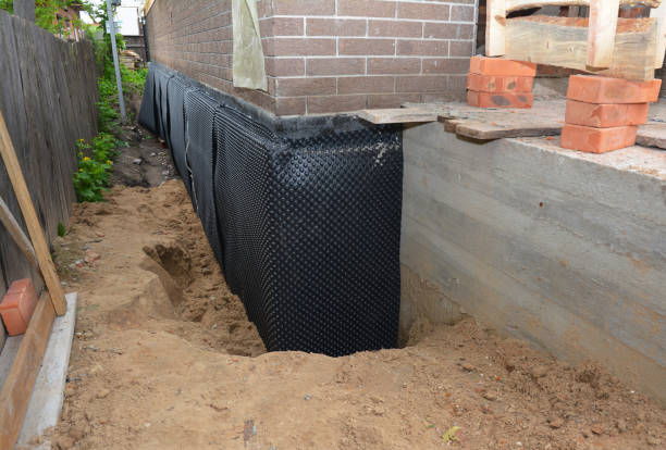 Happy homeowners after waterproofing job in Fowler